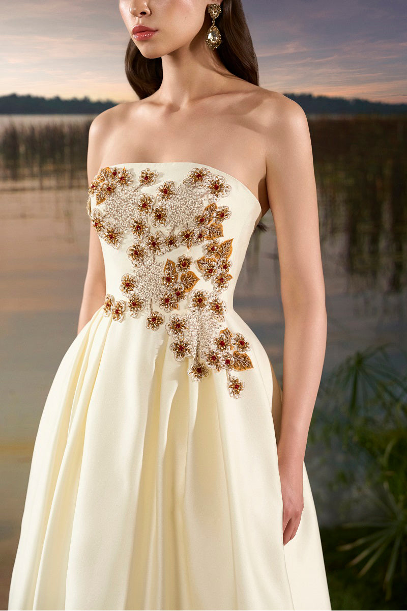 Off-white strapless taffeta maxi dress by Tracy Studio featuring an A-line silhouette and elegant floor-length design.