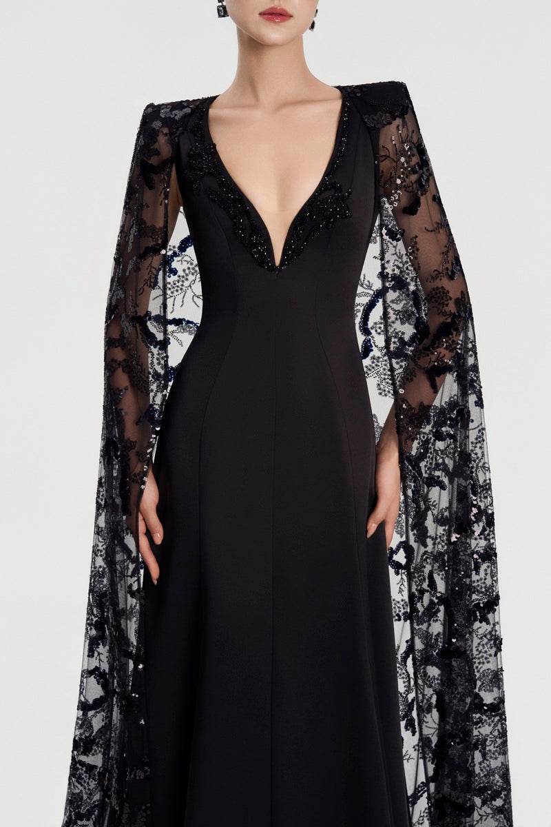Black Taffeta Mikado deep V-neck maxi dress by Tracy Studio, flowing and elegant, with a fitted bodice and full skirt.