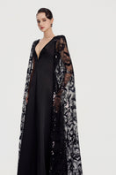 Black taffeta mikado deep V-neck gown by Tracy Studio, elegant floor-length dress with smooth, shiny fabric and sleek design.