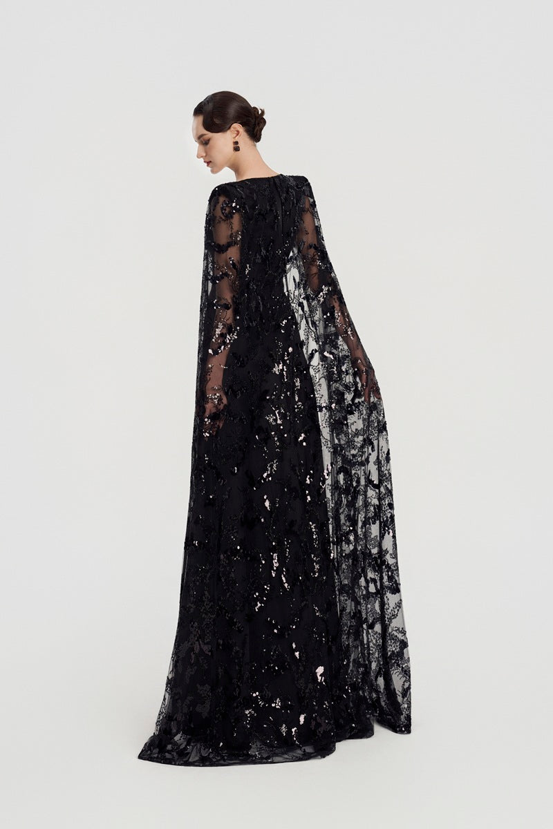 Black Taffeta Mikado deep V-neck maxi dress by Tracy Studio, showcasing elegant fabric and flowing silhouette.