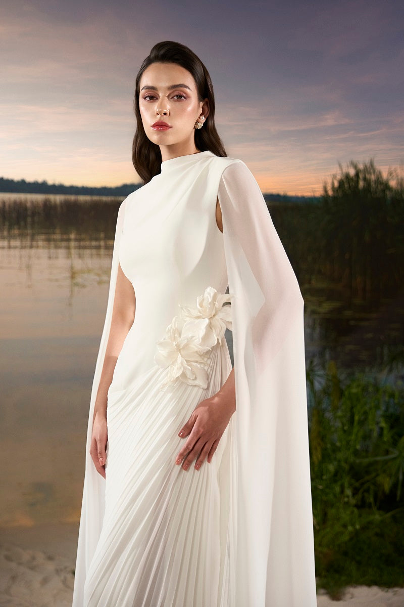 Elegant chiffon floral maxi dress with long sleeves and cape detail by Tracy Studio, featuring a flowing silhouette and vibrant floral pattern.