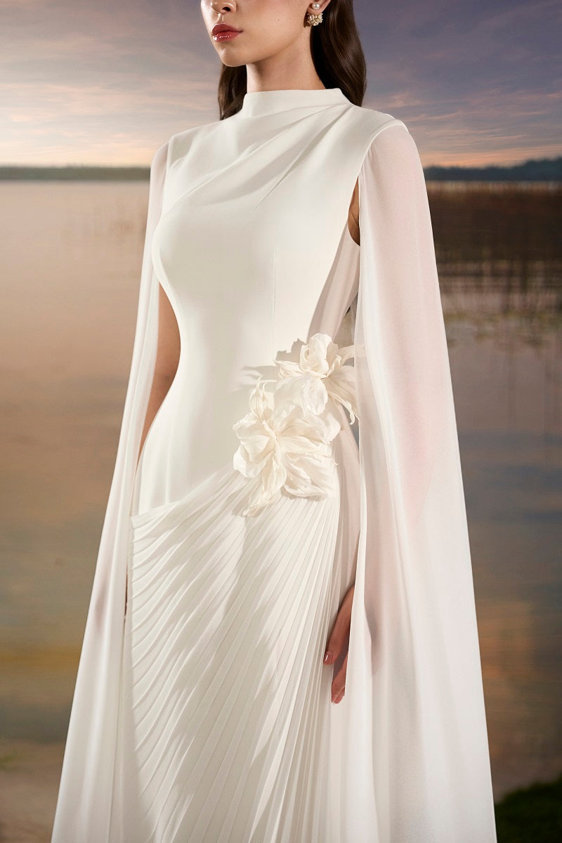 Elegant chiffon floral maxi dress with long sleeve cape by Tracy Studio, featuring a flowing design and intricate floral pattern.