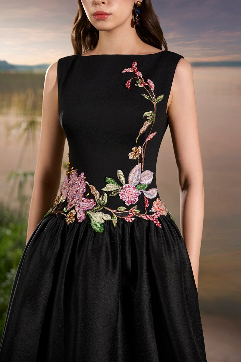 Black crepe embellished maxi dress by Tracy Studio, featuring elegant design and intricate detailing.