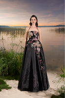 Black organza floral bead-embellished gown by Tracy Studio, featuring intricate bead details and elegant floral embroidery.