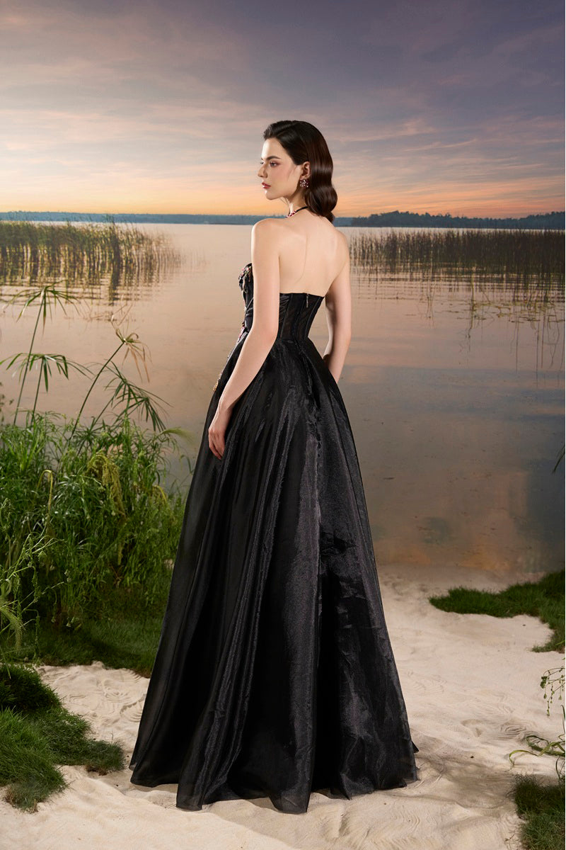 Black Tracy Studio maxi dress with organza floral bead embellishments and elegant design.