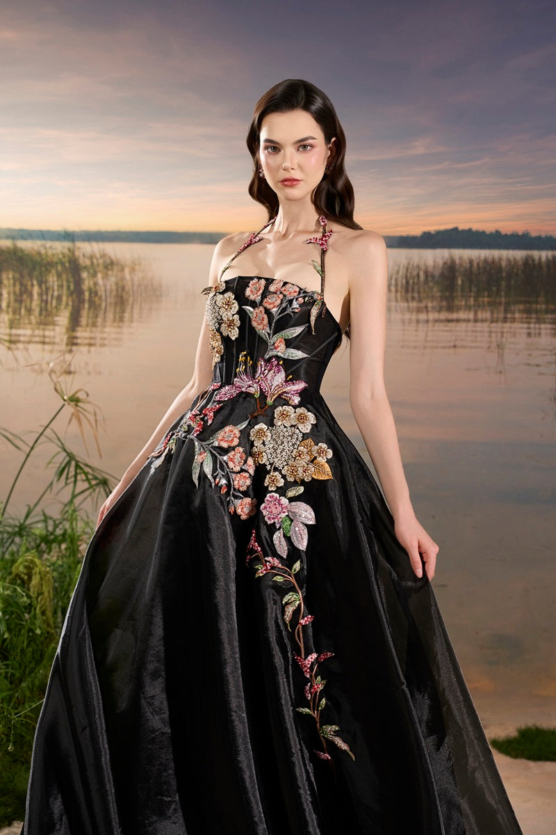 Black Tracy Studio maxi dress with organza floral bead embellishments, featuring a elegant and flowing design.