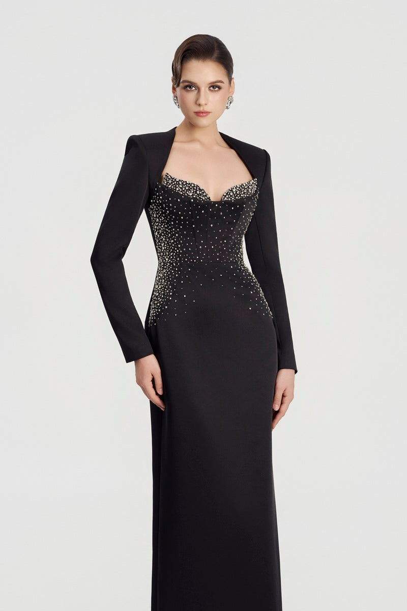 Black embellished maxi dress by Tracy Studio, featuring intricate beadwork and flowing fabric, perfect for elegant occasions.