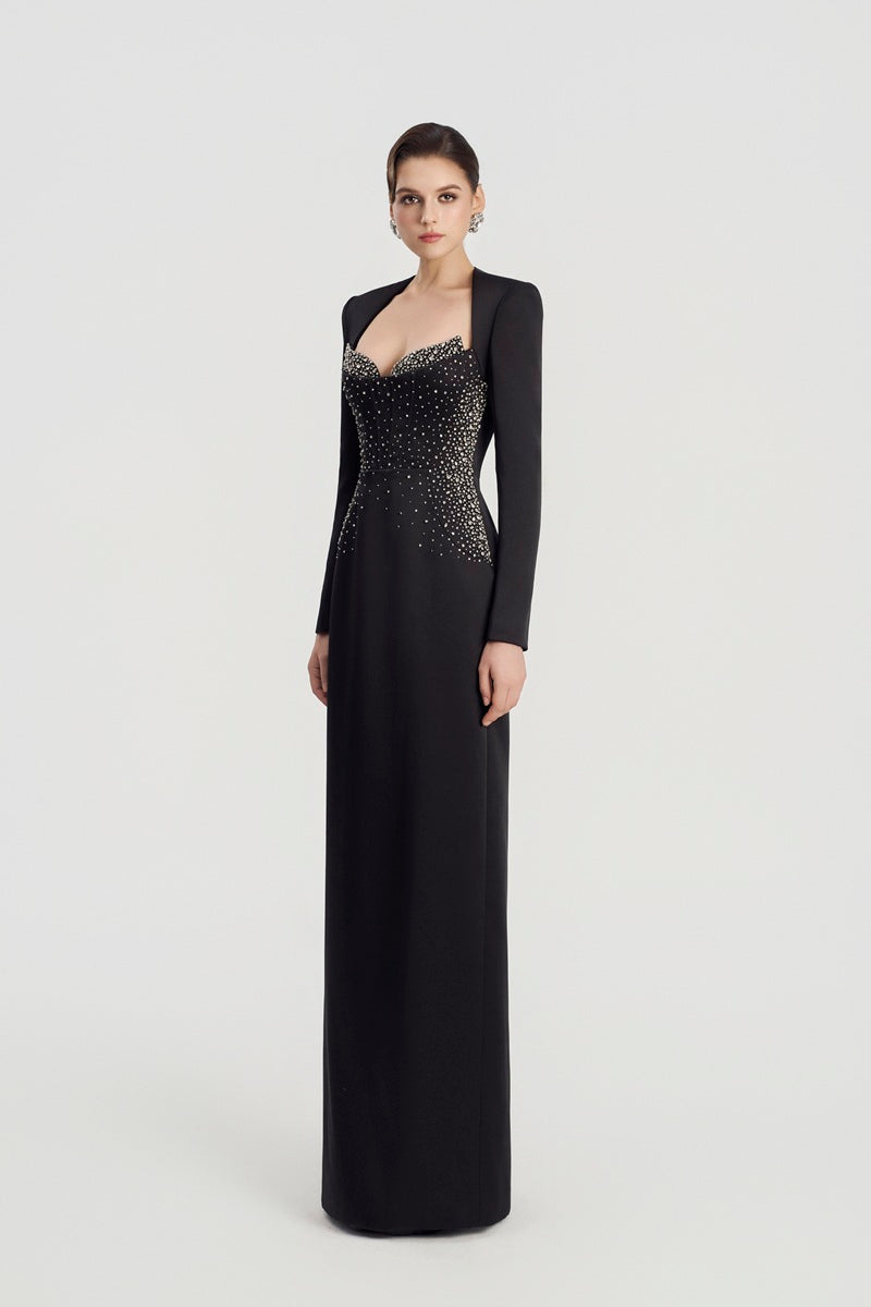Black embellished maxi dress by Tracy Studio featuring intricate beadwork and flowing fabric, perfect for elegant occasions.