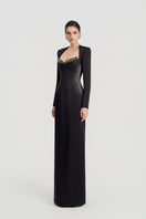 Black embellished gown by Tracy Studio featuring intricate beadwork and elegant design, perfect for formal occasions.