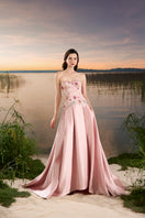Pink chiffon A-line gown by Tracy Studio with flowing fabric and elegant design, perfect for formal occasions.