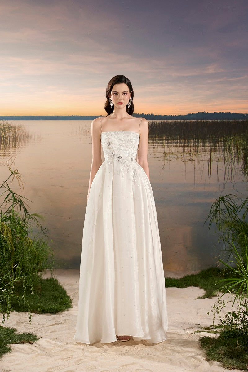 Off-white chiffon A-line maxi dress by Tracy Studio, flowing fabric and elegant design perfect for formal occasions.