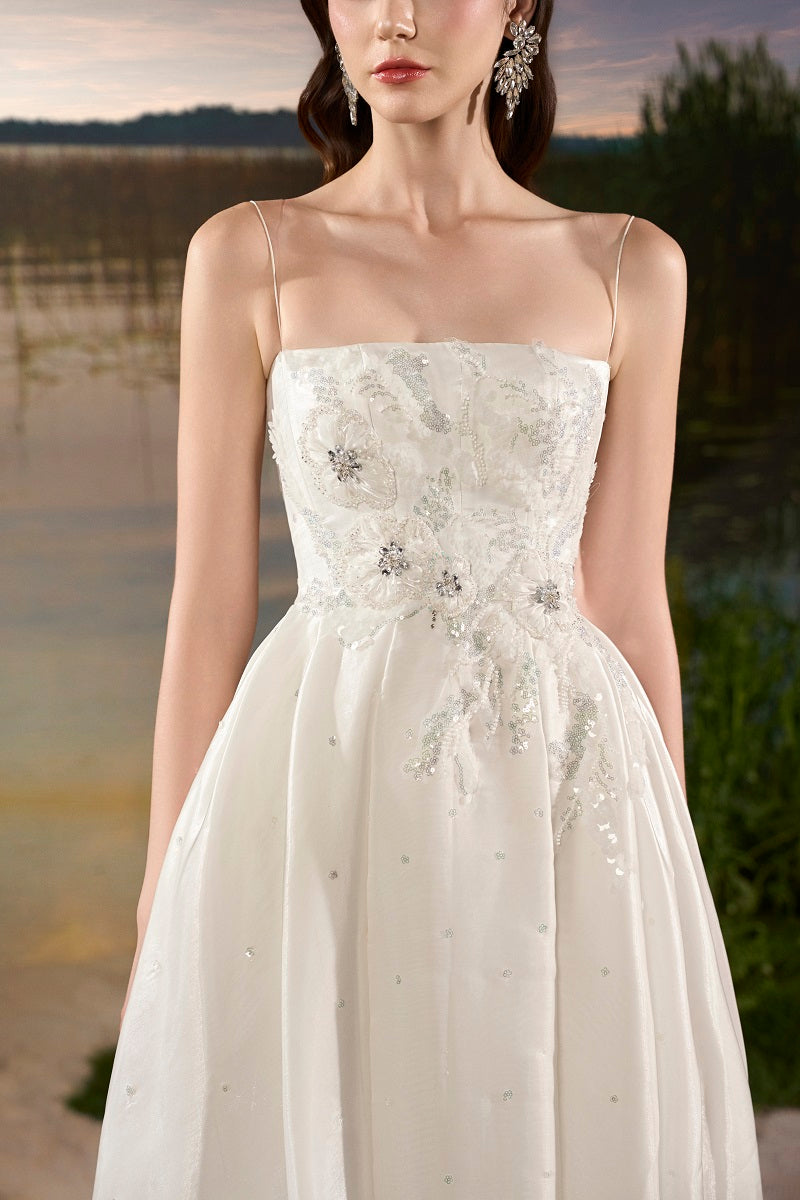 Off-white chiffon A-line maxi dress by Tracy Studio, flowing fabric and elegant design perfect for formal occasions.