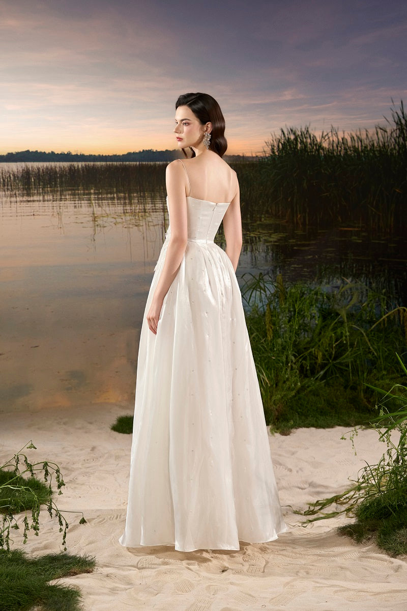 Off-white chiffon A-line maxi dress by Tracy Studio, flowing fabric and elegant silhouette perfect for formal occasions.