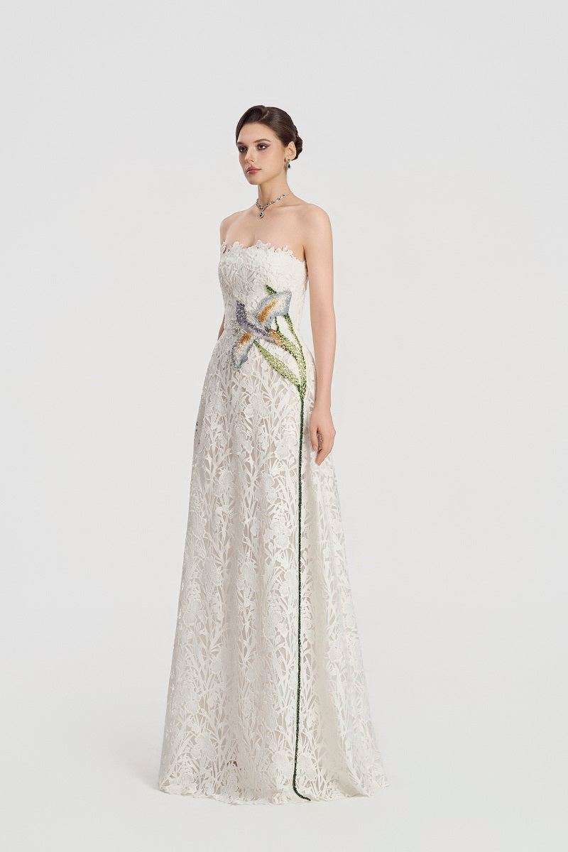 White lace beaded maxi dress from Tracy Studio, featuring intricate detailing and flowing fabric for elegant occasions.