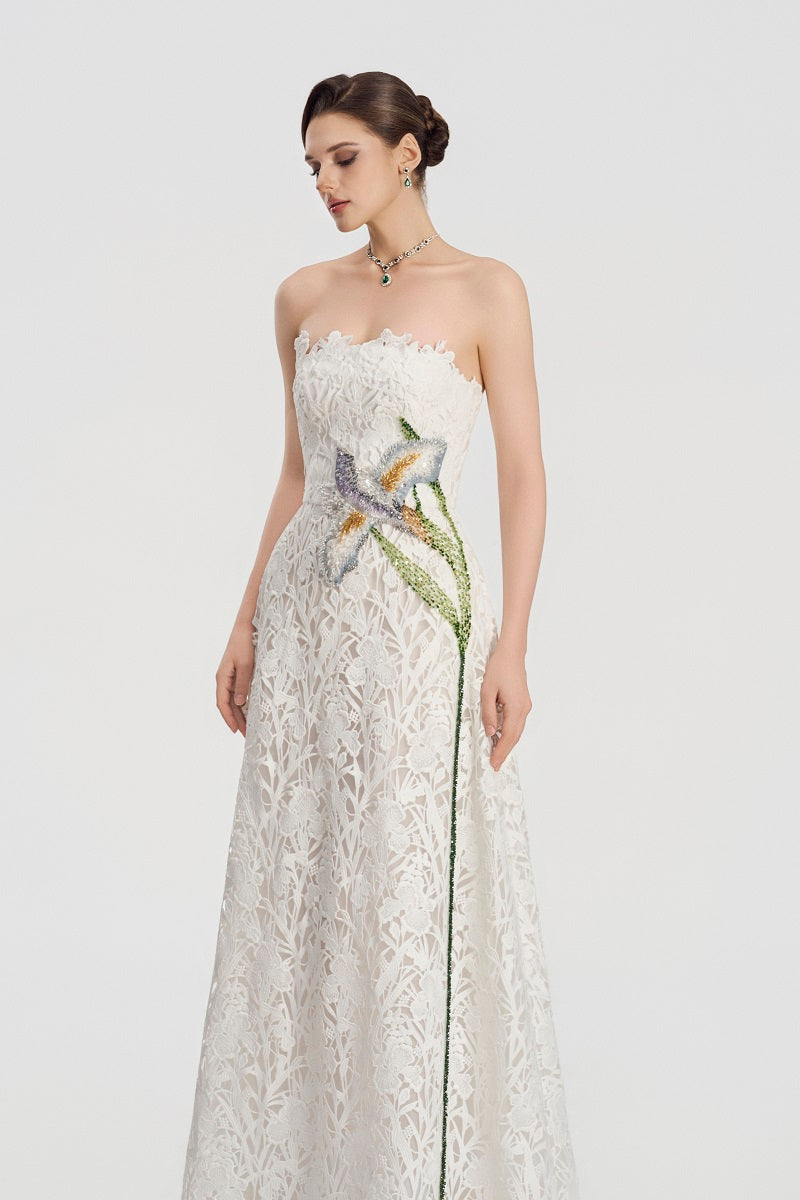 White lace beaded maxi dress by Tracy Studio, featuring intricate beadwork and flowing fabric for elegant style.