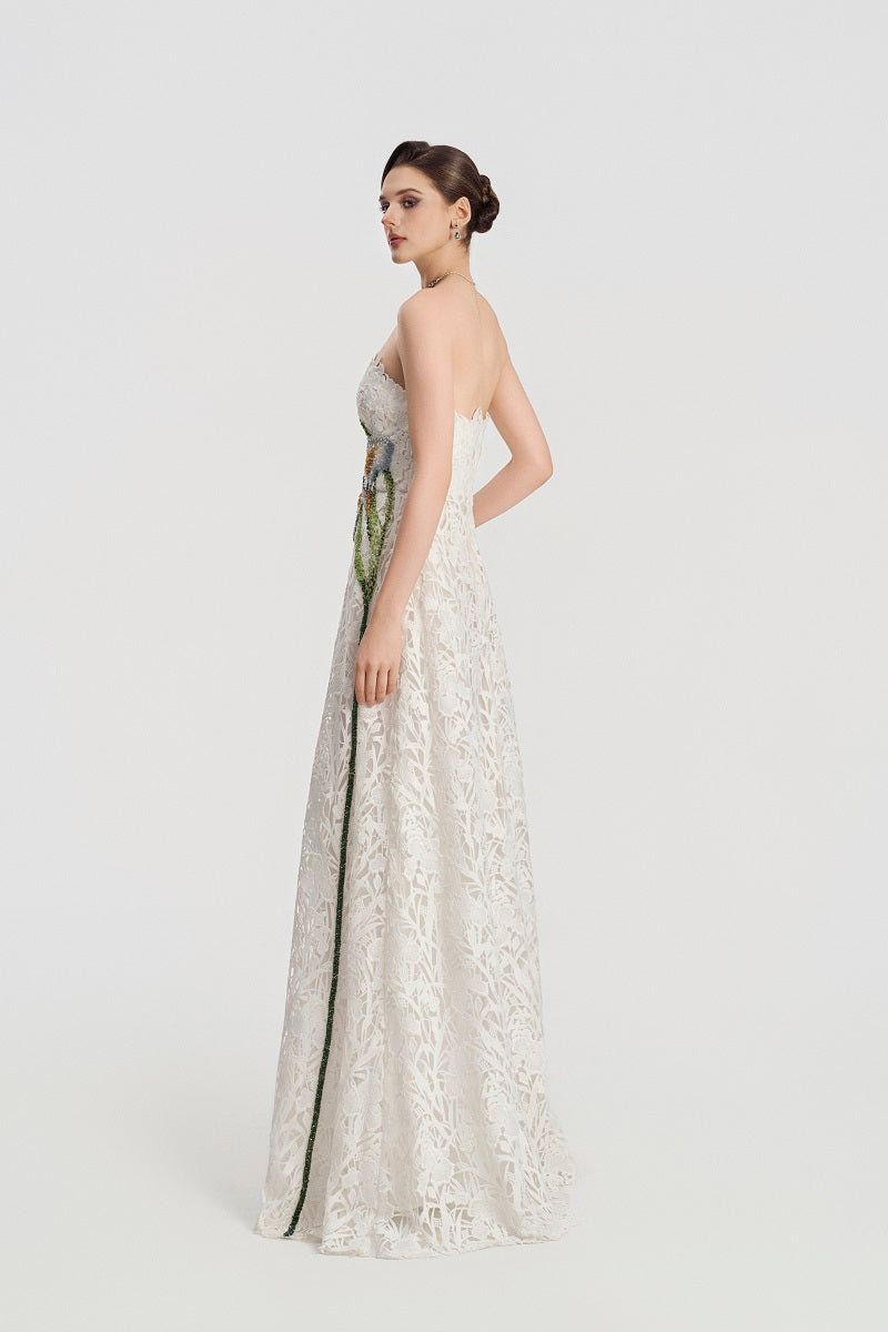 White lace beaded maxi dress by Tracy Studio, featuring intricate beadwork and flowing fabric, perfect for elegant occasions.