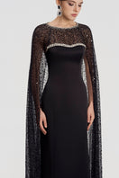 Black taffeta mikado boat neck gown by Tracy Studio, featuring elegant drape and classic silhouette.