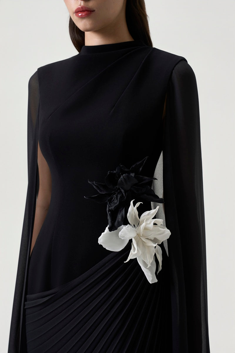 Black chiffon long sleeve maxi dress by Tracy Studio, flowing fabric with elegant long sleeves and a floor-length design.