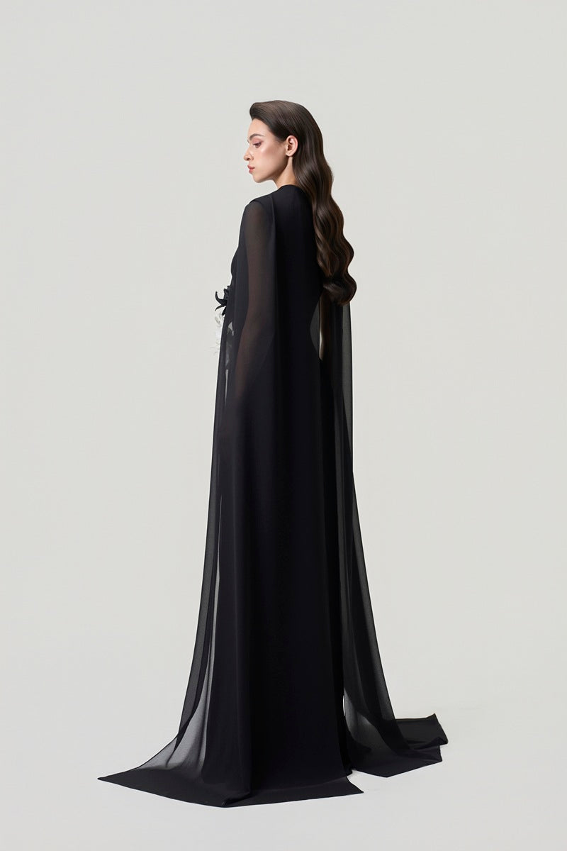 Black chiffon long sleeve maxi dress by Tracy Studio, flowing fabric, elegant design, full-length dress displayed on a model.
