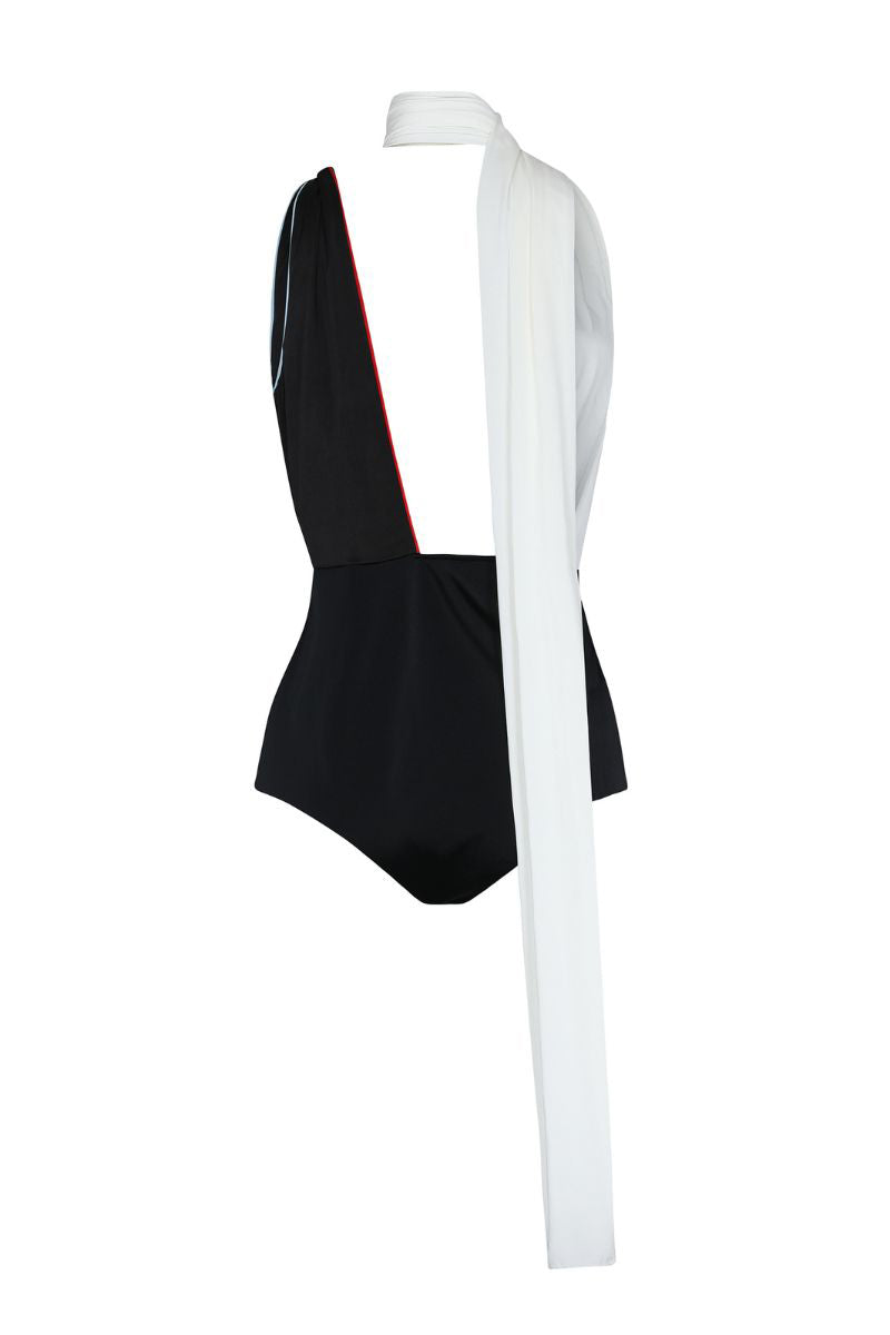 Black and white transformable bodysuit by Balkanica shown from the back, featuring adjustable straps and sleek fit.