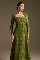 Green I.H.F CULT Mia X trapeze neck A-line gown with long lace sleeves and intricate guipure lace details.