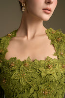 Green I.H.F CULT MIA X trapeze neck A-line gown with long sleeves and guipure lace detailing.