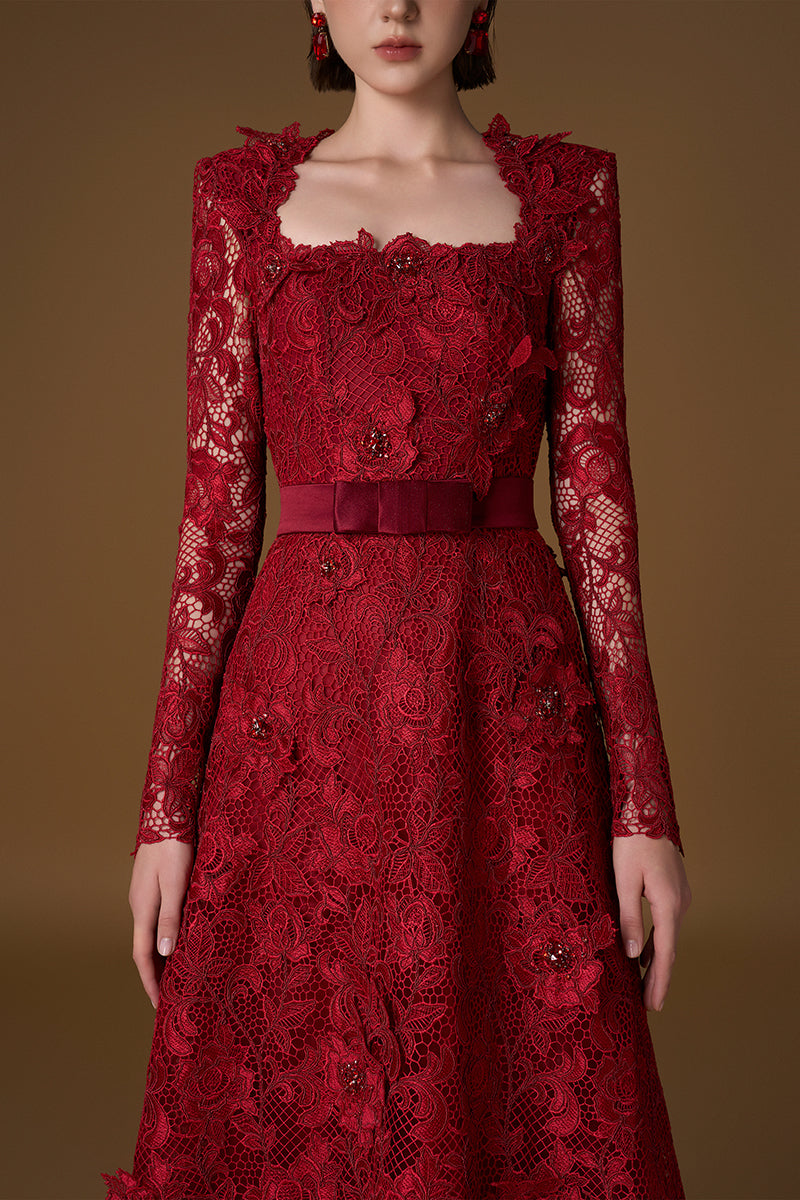 Red I.H.F gown with square guipure lace and silk, featuring a trapeze neckline and long sleeves in an elegant A-line design.