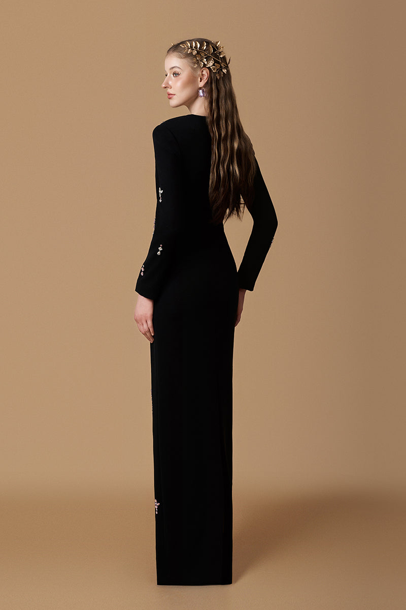 Elegant black crepe maxi dress by I.H.F featuring a trapeze neckline, long sleeves, and pink stone accents.