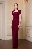 Red I.H.F trapeze short sleeve crepe gown with a relaxed fit and elegant neckline, perfect for formal occasions.