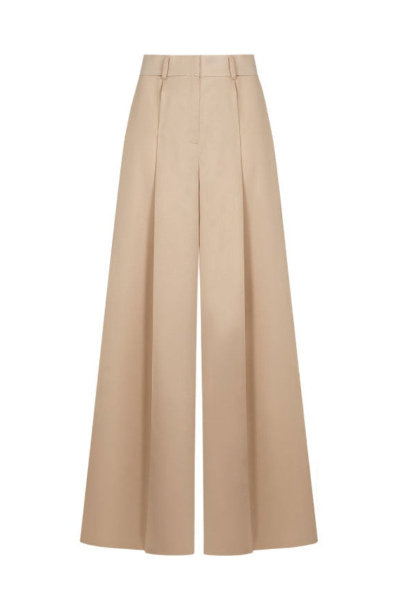 Beige Santa Brands pants with a classic fit, shown on a model, featuring a smooth fabric and tailored design.