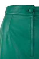Maxi tube skirt in Milano green made from petal leather by MAZ Manuela Álvarez, featuring a sleek, fitted silhouette and smooth texture.