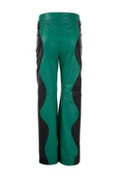 Black and Milano green two-tone leather trousers by MAZ Manuela Álvarez featuring a stylish mountain-inspired design.