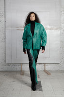 Two-tone leather Mountains trousers in black and Milano green by MAZ Manuela Álvarez, featuring stylish, high-quality design.