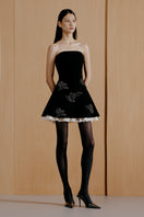 Black Urban Muse velvet mini dress, close-up of fitted silhouette and sleek fabric, perfect for stylish evening wear.
