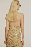 Urban Muse Goldshores maxi dress in gold, elegant sleeveless design with flowing fabric, perfect for summer or special occasions.
