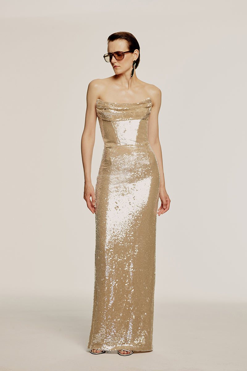 Urban Muse AESTUS nude gown showcasing elegant, flowing fabric and sophisticated design in a stylish evening gown.