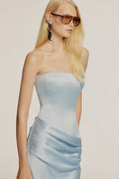 Sky blue CLYMENE maxi dress by URBAN MUSE, flowing fabric and elegant design, shown on a model in a lookbook setting.