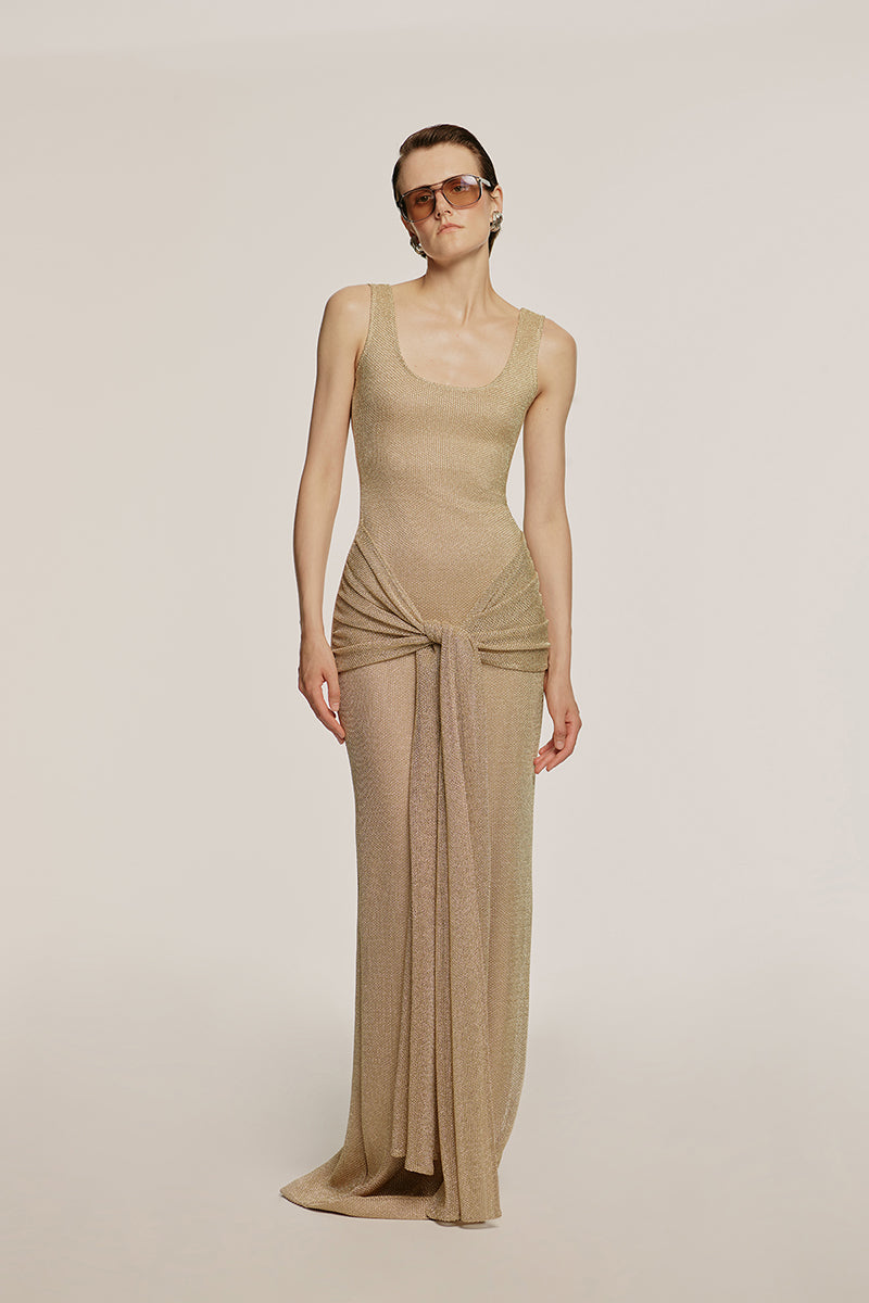 Urban Muse Helios maxi dress in gold, flowing sleeveless design with elegant drape, ideal for summer or formal occasions.