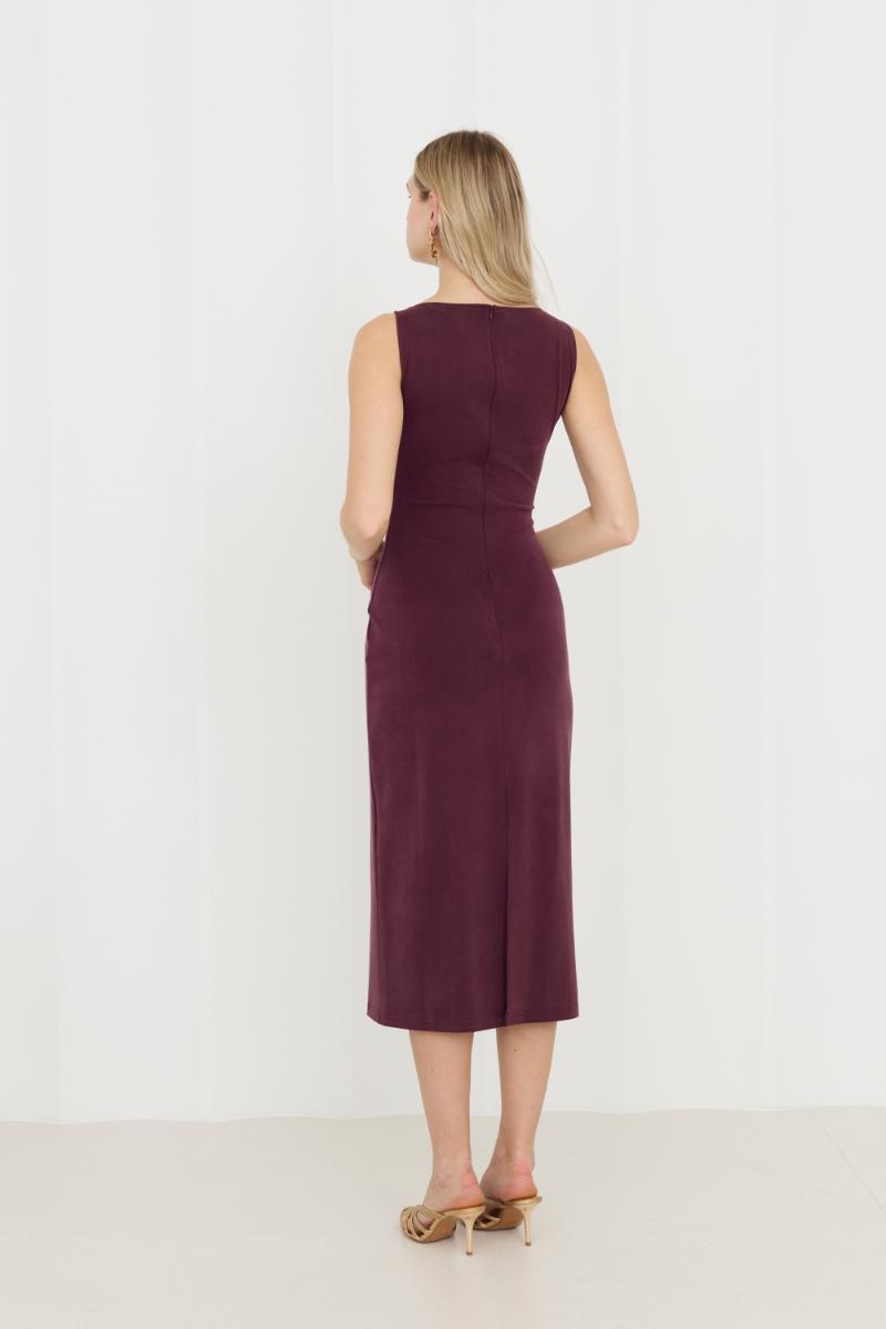 Purple Olivia Grape midi bodycon dress by UNDRESS, form-fitting with a sleek design, shown on a model.