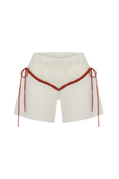 Labeca Colette linen shorts in ecru and red with a relaxed fit, featuring a tie waist and casual summer style.