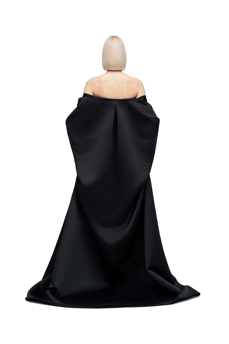 Black Pea Cape jacket by MOON / HAKAN YILDIRIM featuring a stylish, layered design and textured fabric.