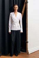 White JOURNEY shirt by Acaria Studio, plain long-sleeve shirt with collar and button-front, displayed flat on a white background.