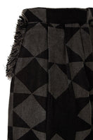 Pair of MAZ Manuela Álvarez baggy pattern pants with a loose fit and colorful geometric design on lightweight fabric.