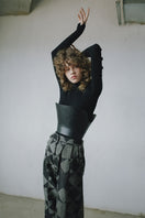 Baggy pattern pants by MAZ Manuela Álvarez featuring a loose fit and vibrant geometric design, shown on a model.