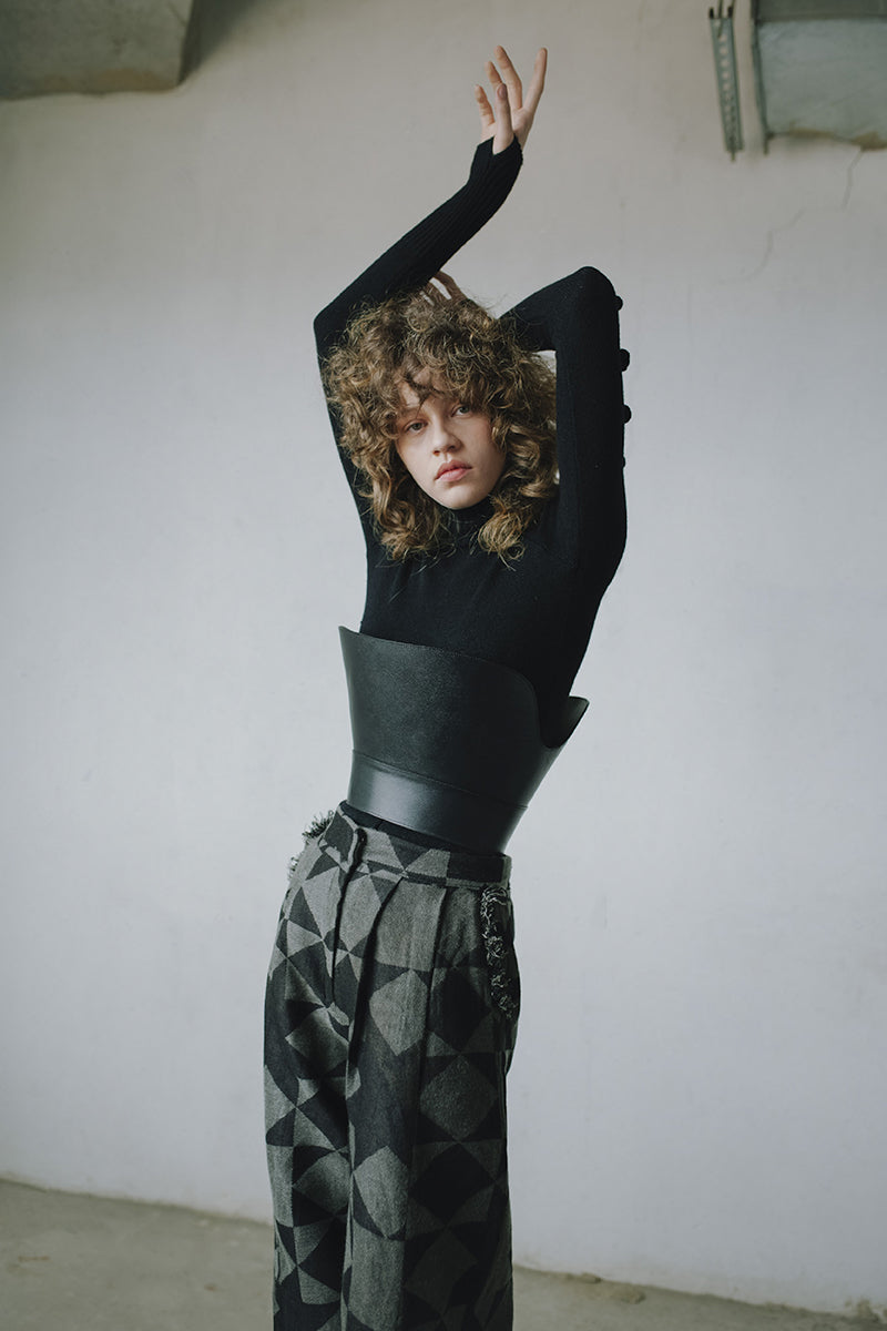 Baggy pattern pants by MAZ Manuela Álvarez featuring a loose fit and vibrant geometric design, shown on a model.