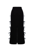 Black linen midi skirt by Labeca featuring a stylish bow detail at the waist.