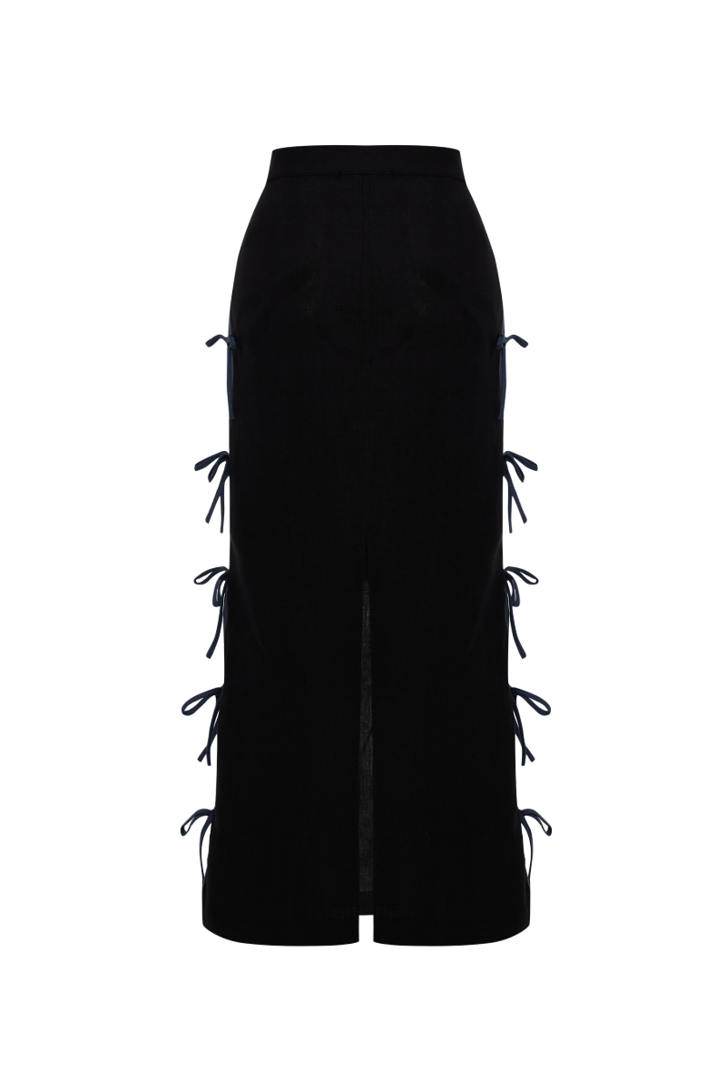 Black linen midi skirt by Labeca featuring a stylish bow detail at the waist.