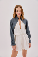 Labeca Claudia ecru linen flare shorts with a high waist and relaxed fit, displayed on a neutral background.