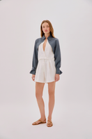 Labeca Claudia ecru and indigo linen layered jacket showing a stylish, lightweight jacket with layered fabric design.