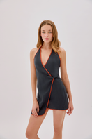 Labeca Sadie navy linen wrap mini dress displayed on a hanger, showcasing its stylish design and lightweight fabric.